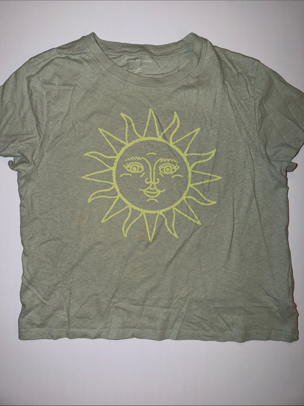 American Eagle Outfitters Sage Green Short Sleeve Tee with Yellow Sun Graphic